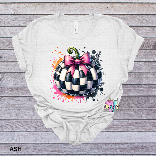 Checkered pumpkin with pink bow
